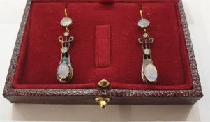 Pair of yellow and white metal, diamond and moonstone drop earrings, each set with two cabochon