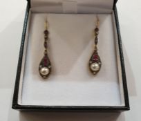 Pair of yellow metal, ruby and diamond drop earrings, each with small rubies and diamonds above