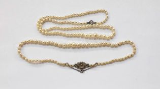 String of graduated cultured pearls on silver and marcasite set clasp and another string of
