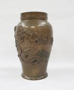 Japanese bronze vase, ovoid and tapering, embossed flying birds, impressed seal mark to base, 27cm
