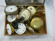 Stainless steel cigarette box containing pocket watches and parts