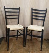 Set of four black matt occasional chairs with ladder backs and woven string work seats