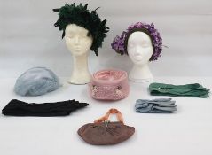 Mitzi Lorenz model hat, labelled, in shades of purple with flowers, on a green net and satin base, a