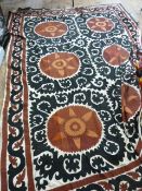 Indian Susani black and rust-coloured wool embroidered onto a cream linen ground, some fraying and