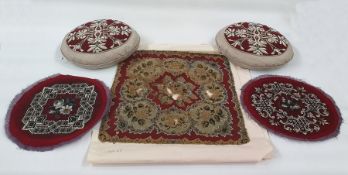 Pair of Berlin woolwork panels on circular grey silk cushions, pair of  Victorian Berlin woolwork