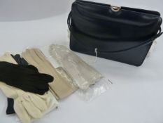Ackery navy leather handbag, two pairs Cornelia James lady's gloves, pair of lady's cream leather