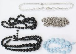 Gilt metal and faux-pearl tiara with scroll decoration, quantity bead necklaces, gold bead