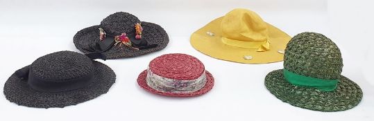 Various vintage hats including a black straw decorated with faux-flowers, a large coolie hat with