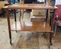 Mid-20th century teak two tier tea trolley, the half gallery tray top above uniting the under-tier