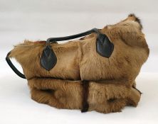 Travel bag made out of cow hide