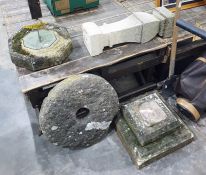 Stone weathered sundial, the metal sundial set centre, on stone plinth and square stepped base