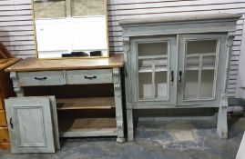 Pine and painted dresser with ogee moulded pediment above the doors enclosing shelves, a base of two