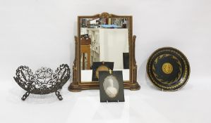 Gilt and black metal shallow dish decorated with Medusa head, a gilt and stained wood easel