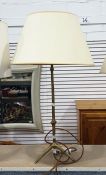 Brass table lamp with turned column and tripod base, with cream shade