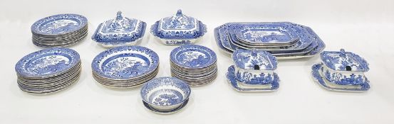 Large quantity of underglaze blue 'Willow' pattern decorated tableware to include four graduated