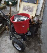 Seed / fertilizer spreader, quantity of golf clubs within a golf carry case and a lady's spade