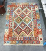 Cream ground rug with blue, green and red diamond
