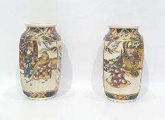 Pair of Japanese pottery vases, each shouldered and panelled, decorated with scenes of warriors