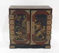 Japanese lacquered and painted table-top cabinet with three drawers enclosed by pair panel doors,