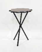 Tartan-topped ebonised wood tripod table with faceted supports, the top with scalloped edgeCondition
