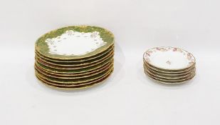Set of three Limoges porcelain dinner plates by J Pouya with green and gilt brocade borders,