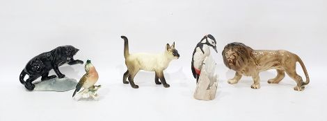 Beswick model black panther on rock, 14cm high, a Melbaware model lion, a Karl Ens porcelain model