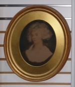 Pair of coloured prints, within oval gilt frames, showing late 18th century portraits of ladies,