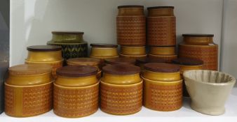 Large collection of Hornsea 'Saffron' pattern pottery storage jars, cylindrical, with wooden covers,
