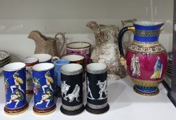 Two various pairs of cylindrical ceramic spill vases with classical figure decoration, a similar
