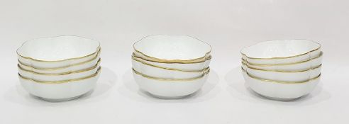 Set of twelve Raynaud Limoges white porcelain lobed dessert bowls, gilt bordered