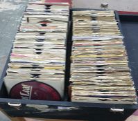 Case of 45rpm singles to include examples by ACDC, Adam and the Ants, The Banned, The Beatles, The