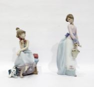 Lladro porcelain figure of a girl with basket and a Lladro porcelain figure of girl with telephone