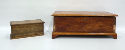 Oak box raised on bracket feet and an oak and inlaid tea caddy (2)
