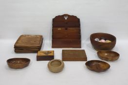Large quantity of treen including carved salad bowls, wooden trays, letter rack, slide rule, fruit