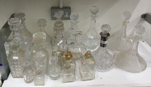 Pair of continental gilt glass square small decanters, 13 variously cut or moulded decanters with