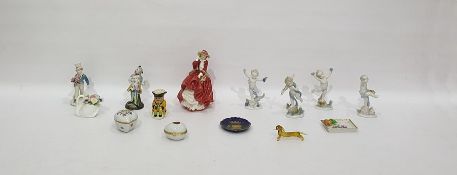 Set of four German porcelain putti 