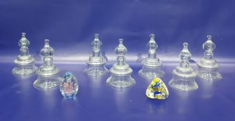 Set of seven glass inverse bell-shaped candle holders with a single gilt metal wall bracket and