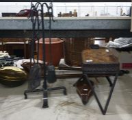 Two brass and wood warming pans, a fireside companion set, a pair of foot-operated bellows and