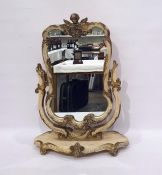 Dressing table swing mirror in the rococo taste, the whole surmounted by cherub, all painted cream