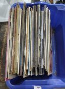 Box of vinyl LP's from the 80's including Simply Red, The Eurythmics, The House Martins, etc.