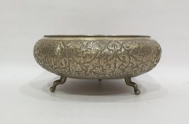 Eastern white metal circular bowl, with foliate surround, raised on cabriole feet, 25cm diameter,
