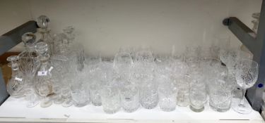 Six various cut glass decanters and a large quantity of cut drinking glasses to include goblets,