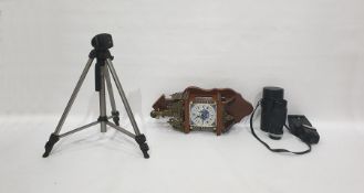 Wall clock with a Delft tile face, brass pediment and assorted camera equipment