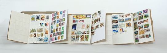 Quantity of partly filled approval books with stamps of many countries and unused stock cards, a box