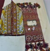 A Turkoman Yomud ceremonial saddle bag, together with a Turkoman silk embroidered kaftan