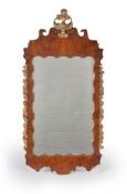 A George II figured walnut and parcel gilt wall mirror