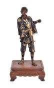 Miya-O Eisuke: A Parcel Gilt Bronze Figure of a Falconer