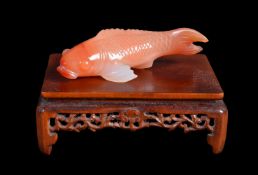 A Chinese or Japanese Carnelian agate small carp carving