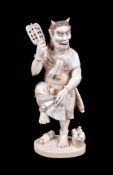 ϒ SHUNKO (TOSHIMITSU): A Japanese Ivory Okimono carved as smiling Oni dancing on one leg