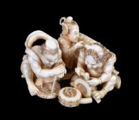 ϒ EISHIN: A Japanese Ivory Okimono of a Nio repairing a waraji sandal